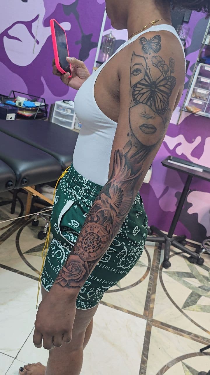 Black and grey Full sleeve in progress tattoo on the full arm, by Soulraven Studios in Kingston, Jamaica